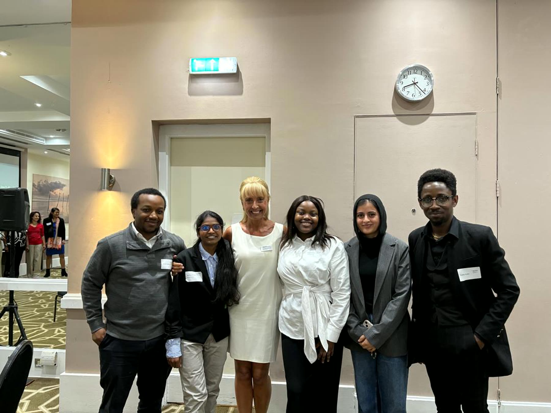 Bridge the Gap project team standing together at a professional event