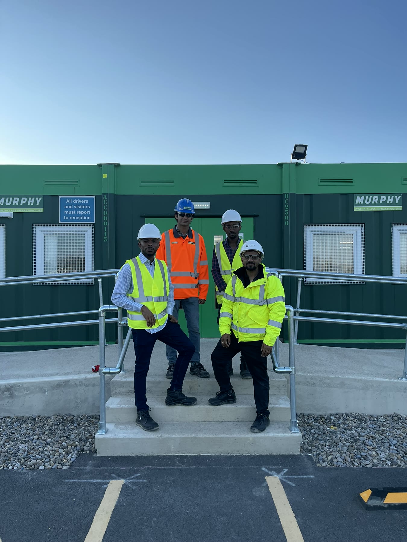 Four participants in site PPE during the CIOB Site Visit