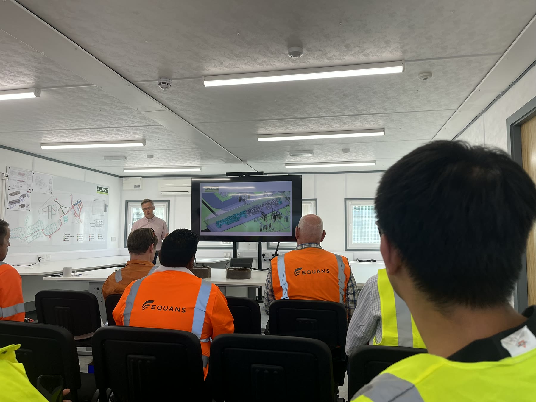 Participants attending a project briefing during the CIOB Site Visit